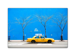 Yellow cab in blue city